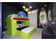 Fun themed room with custom bunk beds featuring a rocket ship and alien accents at 4294 Lana Ave, Davenport, FL 33897
