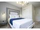 Bright bedroom with a modern bed, custom headboard, and stylish bedside table at 4294 Lana Ave, Davenport, FL 33897