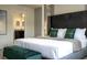 Elegant bedroom with stylish headboard, luxury bedding, and an en-suite bathroom at 4294 Lana Ave, Davenport, FL 33897