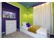 Bright bedroom featuring colorful walls, modern TV, dresser, and a comfortable twin bed at 4294 Lana Ave, Davenport, FL 33897