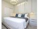 Bedroom featuring modern lighting and furnishings and a queen-sized bed at 4294 Lana Ave, Davenport, FL 33897