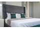 Close-up of the primary bedroom, showcasing a luxurious bed and decorative pillows at 4294 Lana Ave, Davenport, FL 33897