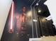 Hallway featuring a Star Wars themed mural on the wall and dark doors and trim at 4294 Lana Ave, Davenport, FL 33897