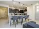 Modern kitchen features sleek countertops, stainless steel appliances, and a breakfast bar with seating at 4294 Lana Ave, Davenport, FL 33897