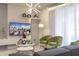 Cozy living room with plush seating, modern decor, and a wall-mounted TV at 4294 Lana Ave, Davenport, FL 33897