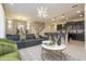 Open-concept living area with a comfortable sofa, modern decor, and an adjacent kitchen at 4294 Lana Ave, Davenport, FL 33897