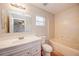 Clean bathroom with a tub, toilet, and vanity at 441 Danube Dr, Kissimmee, FL 34759