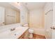 Bathroom featuring a tub, toilet, and vanity with wood cabinets at 441 Danube Dr, Kissimmee, FL 34759