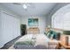 Comfortable bedroom featuring plank flooring, a large window, and a spacious closet at 441 Danube Dr, Kissimmee, FL 34759