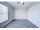 Simple bedroom with wood-look floors and large window at 441 Danube Dr, Kissimmee, FL 34759