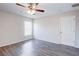 Well-lit bedroom featuring wood-look floors and ceiling fan at 441 Danube Dr, Kissimmee, FL 34759