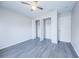 Vacant bedroom featuring wood flooring, and a double door closet at 441 Danube Dr, Kissimmee, FL 34759