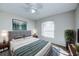 Modern bedroom with an oversized headboard, plush carpeting, and a bright window at 441 Danube Dr, Kissimmee, FL 34759