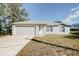 Single-story house with attached garage and well-maintained lawn at 441 Danube Dr, Kissimmee, FL 34759
