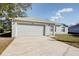Front view of a single story house with a garage at 441 Danube Dr, Kissimmee, FL 34759