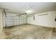 Garage with automatic door and concrete floor at 441 Danube Dr, Kissimmee, FL 34759