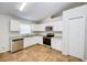 Modern kitchen with white cabinets and stainless steel appliances at 441 Danube Dr, Kissimmee, FL 34759