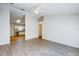 Spacious living room, open to kitchen with wood-look floors at 441 Danube Dr, Kissimmee, FL 34759
