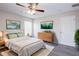 Bright main bedroom features a ceiling fan, light gray walls, wood flooring, and modern decor at 441 Danube Dr, Kissimmee, FL 34759