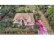 House with brown roof, large backyard, and wooded surroundings at 6900 Sw 137Th Court Rd, Ocala, FL 34481