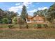 Landscaped lawn with a one story home at 6900 Sw 137Th Court Rd, Ocala, FL 34481