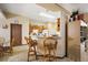 Kitchen with wood cabinets, tiled floors, and breakfast bar at 6900 Sw 137Th Court Rd, Ocala, FL 34481