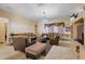 Comfortable living room with ample seating and a large TV at 6900 Sw 137Th Court Rd, Ocala, FL 34481