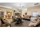 Open living room with adjacent kitchen and dining areas at 6900 Sw 137Th Court Rd, Ocala, FL 34481