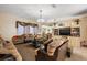 Spacious living room featuring two sofas and a media cabinet at 6900 Sw 137Th Court Rd, Ocala, FL 34481