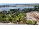Elevated shot of property near lake and city with construction site and concrete culverts nearby at 11326 Westwood Blvd, Orlando, FL 32821