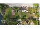 Expansive aerial view showing the home's location and layout relative to the lake and other buildings at 11326 Westwood Blvd, Orlando, FL 32821