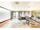 Bright living room with stylish furniture, a large rug, and scenic views through sliding glass doors at 11326 Westwood Blvd, Orlando, FL 32821