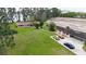 Aerial view of property showing large yard, 3 parked cars, and proximity to lake and development at 11326 Westwood Blvd, Orlando, FL 32821
