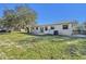 Home exterior view and backyard with grassy area at 1236 Merritt St, Altamonte Springs, FL 32701