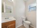 Clean bathroom with wood vanity and updated toilet at 1236 Merritt St, Altamonte Springs, FL 32701