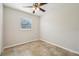 Simple bedroom with tile floors and ceiling fan at 1236 Merritt St, Altamonte Springs, FL 32701