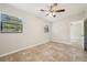 Spacious bedroom with ceiling fan and access to hallway at 1236 Merritt St, Altamonte Springs, FL 32701