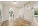 Dining area with tile flooring and arched openings to kitchen at 1236 Merritt St, Altamonte Springs, FL 32701