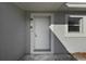 White front door entry with light fixture and doorbell at 1236 Merritt St, Altamonte Springs, FL 32701