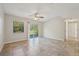 Living room with tile floors, ceiling fan, and sliding glass doors at 1236 Merritt St, Altamonte Springs, FL 32701