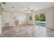 Living room with tile floors, sliding glass doors and view of backyard at 1236 Merritt St, Altamonte Springs, FL 32701