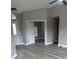 Bright living room boasts modern flooring and neutral paint, perfect for creating a comfortable and inviting atmosphere at 15613 Greater Groves Blvd, Clermont, FL 34714