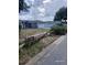 Street view of a well-maintained home with a tidy yard and driveway, showcasing neighborhood charm at 15613 Greater Groves Blvd, Clermont, FL 34714