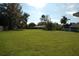 Large grassy backyard with mature trees at 1712 Lake Alden Dr, Apopka, FL 32712