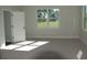 Bright bedroom with carpet and large windows at 1712 Lake Alden Dr, Apopka, FL 32712
