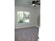 Bright bedroom with carpeted floor and large window at 1712 Lake Alden Dr, Apopka, FL 32712