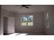 Bright bedroom with carpet and large windows at 1712 Lake Alden Dr, Apopka, FL 32712