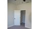 Bedroom with white door and walk-in closet at 1712 Lake Alden Dr, Apopka, FL 32712