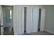 Spacious bedroom with multiple white closet doors at 1712 Lake Alden Dr, Apopka, FL 32712