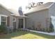 House exterior with stone accents and landscaping at 1712 Lake Alden Dr, Apopka, FL 32712
